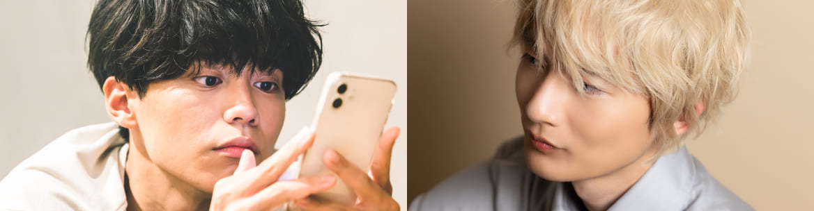 ナチュラルな光の中でポーズをとる男性。 明るい金髪の男性が視線を落とす横顔。